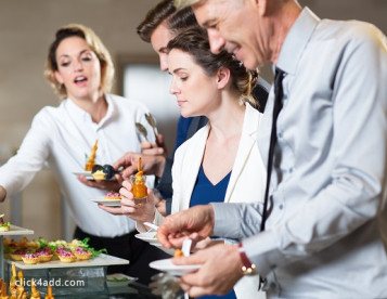 business-people-serving-themselves-with-snacks Affordable Corporate Event Catering in Westfield